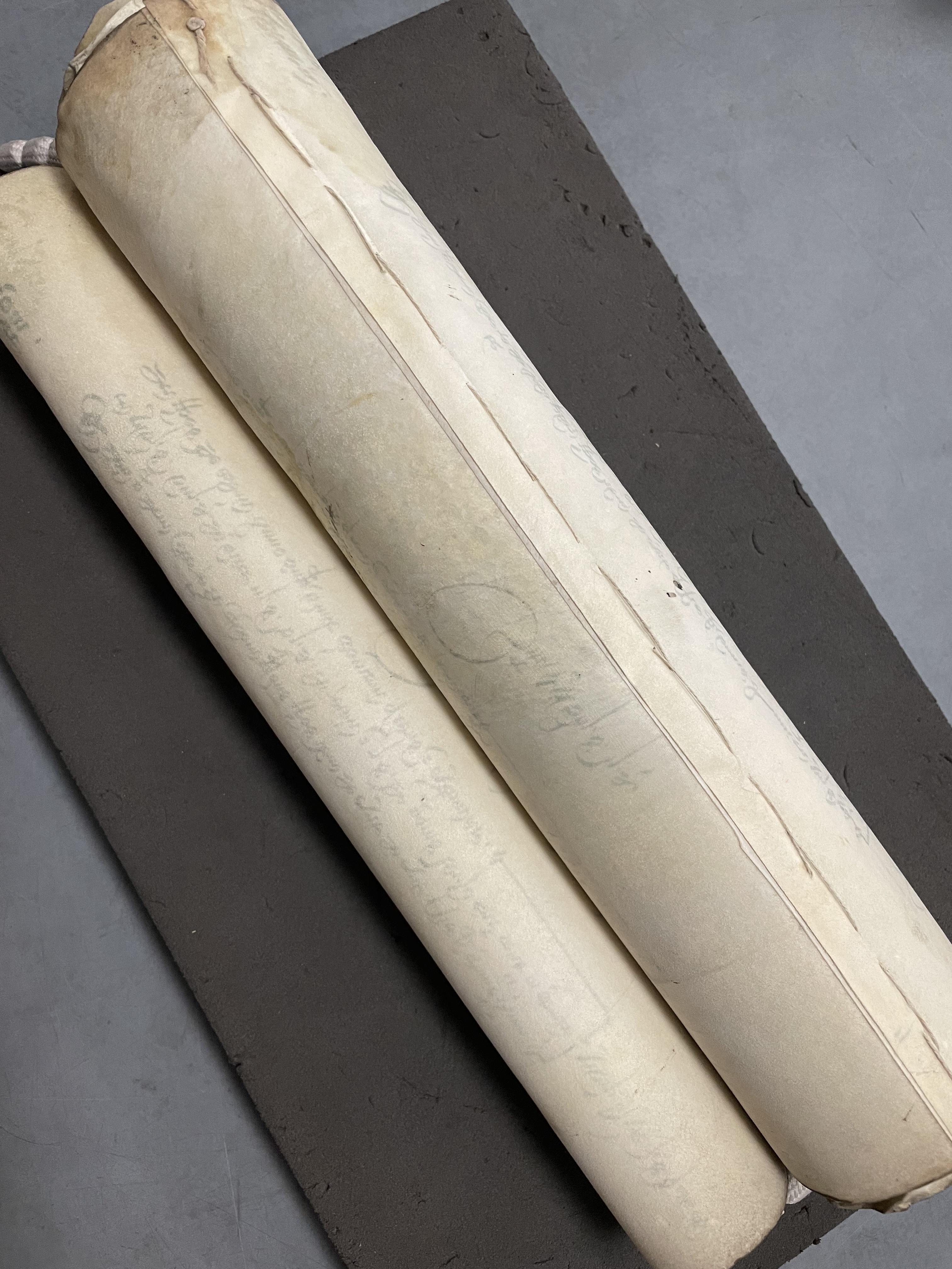 A 16th century parchment roll showing the stitching on the reverse